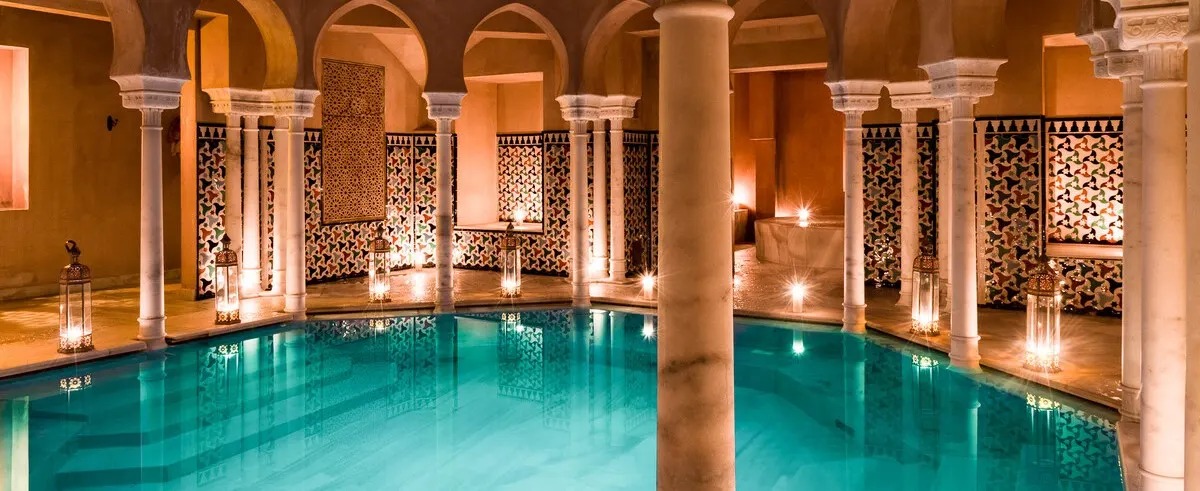 A luxurious indoor spa pool with elegant architecture at a best yoga retreats spain location.