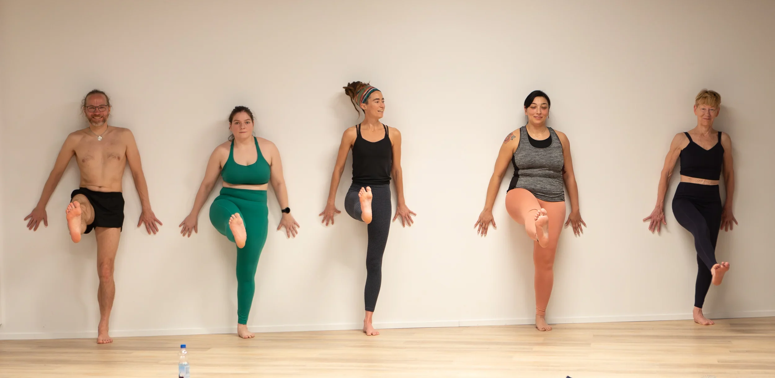 five people standing during a Hot Yoga Workshop in Den Haag