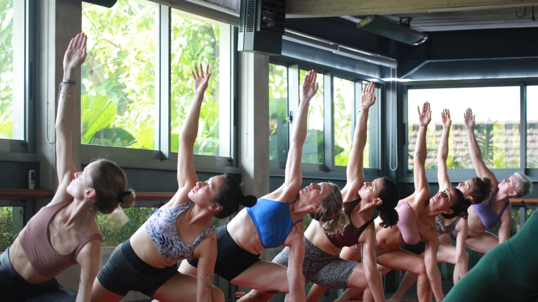 students practice triangle posture during e84 immersion week